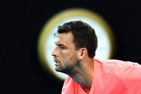 epa06445818 Grigor Dimitrov of Bulgaria in action during his second round match against Mackenzie McDonald of the USA at the Australian Open Grand Slam tennis tournament in Melbourne, Australia, 17 Ja ...