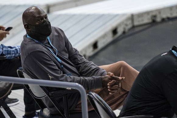 Charlotte Hornets owner Michael Jordan watches the second half of the team&#039;s NBA basketball game against the Detroit Pistons in Charlotte, N.C., Thursday, March 11, 2021. (AP Photo/Jacob Kupferma ...