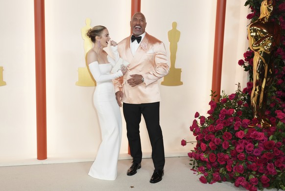 Emily Blunt, left, and Dwayne Johnson arrive at the Oscars on Sunday, March 12, 2023, at the Dolby Theatre in Los Angeles. (Photo by Jordan Strauss/Invision/AP)
Emily Blunt,Dwayne Johnson