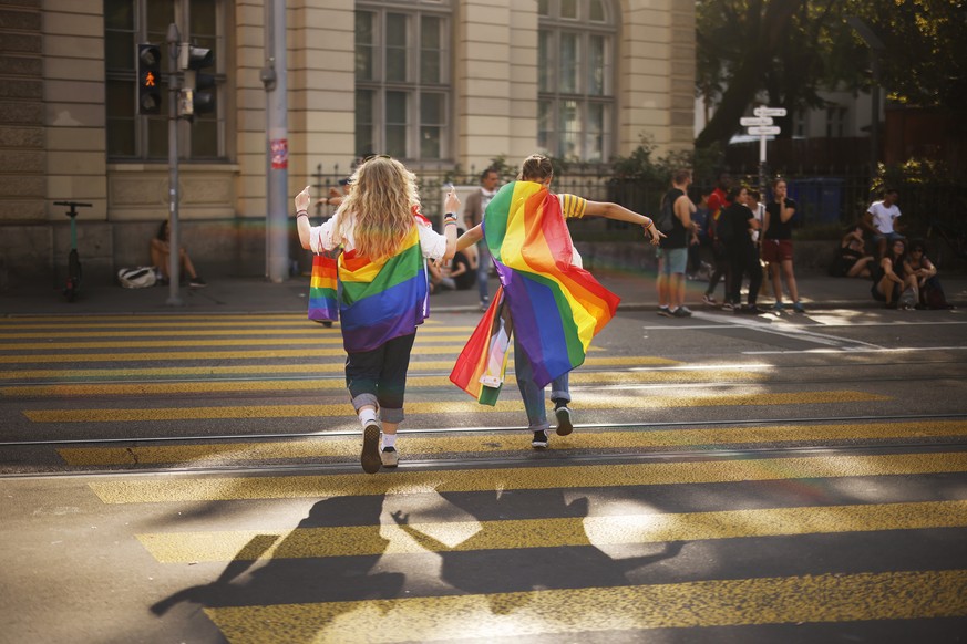 People demonstrate at the Zurich Pride parade in Zurich, Switzerland, with the slogan &quot;Dare. Marriage for all, now!&quot; (Trau Dich. Ehe fuer alle. Jetzt!) for the rights of the LGBTIQ community ...