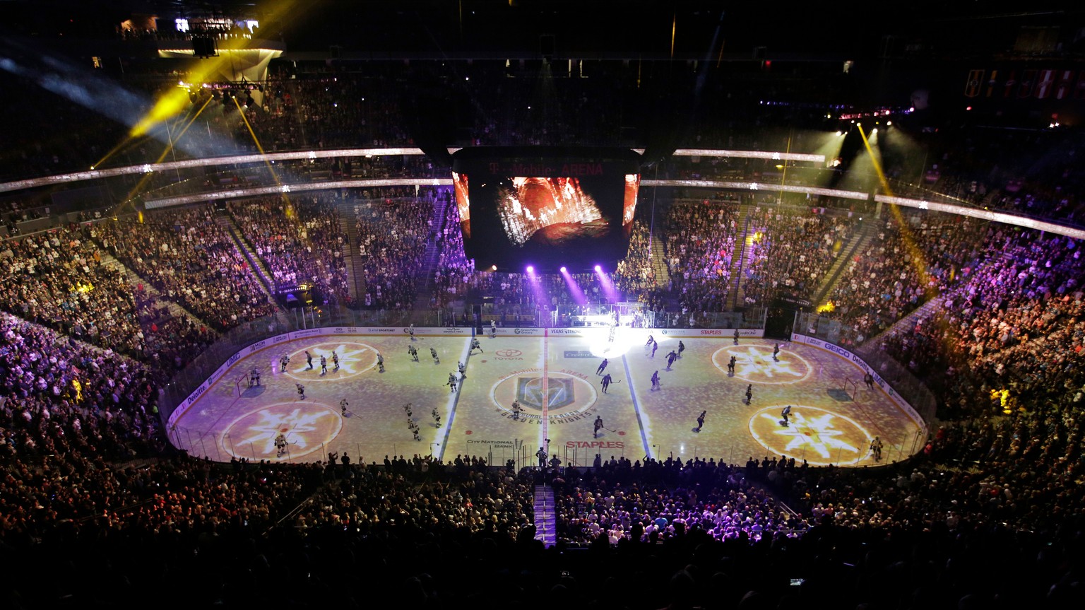 FILE - In this March 31, 2018, file photo, players warm up before an NHL hockey game between the Vegas Golden Knights and the San Jose Sharks, in Las Vegas. It took one trip to Las Vegas early in the  ...