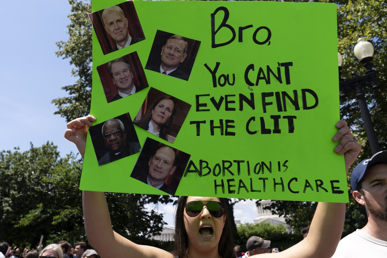 An abortion-rights activist protests outside the Supreme Court in Washington, Saturday, June 25, 2022. The Supreme Court has ended constitutional protections for abortion that had been in place nearly ...