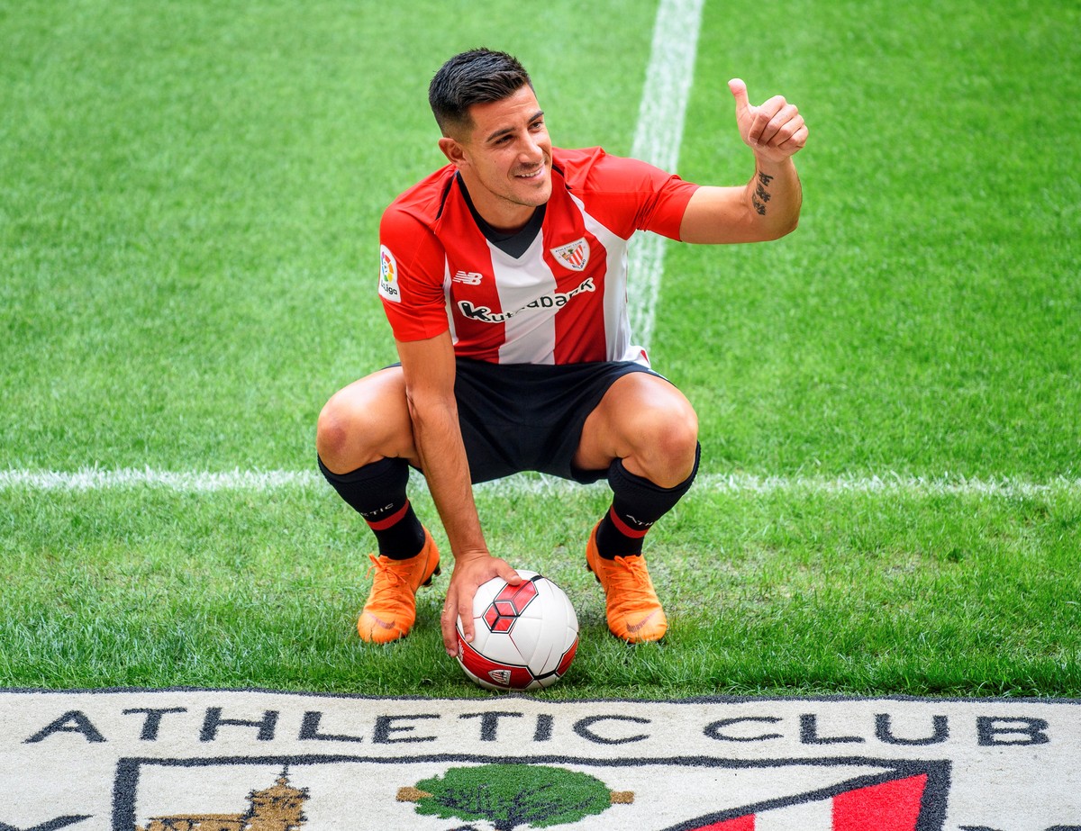 epa06867866 Athletic Bilbao's new Spanish player Yuri Berchiche poses for photographers during his presentation at the San Mames stadium in Bilbao, Spain, 06 July 2018. Berchiche joined Athletic  ...