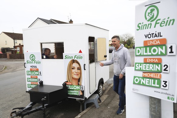 A man leaves a polling station in Clonoe, Northern Ireland, Thursday May 5, 2022. Sinn Fein, a force in Irish republicanism on both sides of the Irish border looks likely to become the largest party i ...