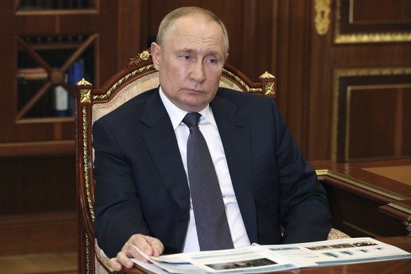 Russian President Vladimir Putin attends a meeting with Moscow Region Governor Andrei Vorobyov at the Kremlin in Moscow, Russia, Monday, July 11, 2022. (Mikhail Klimentyev, Sputnik, Kremlin Pool Photo ...
