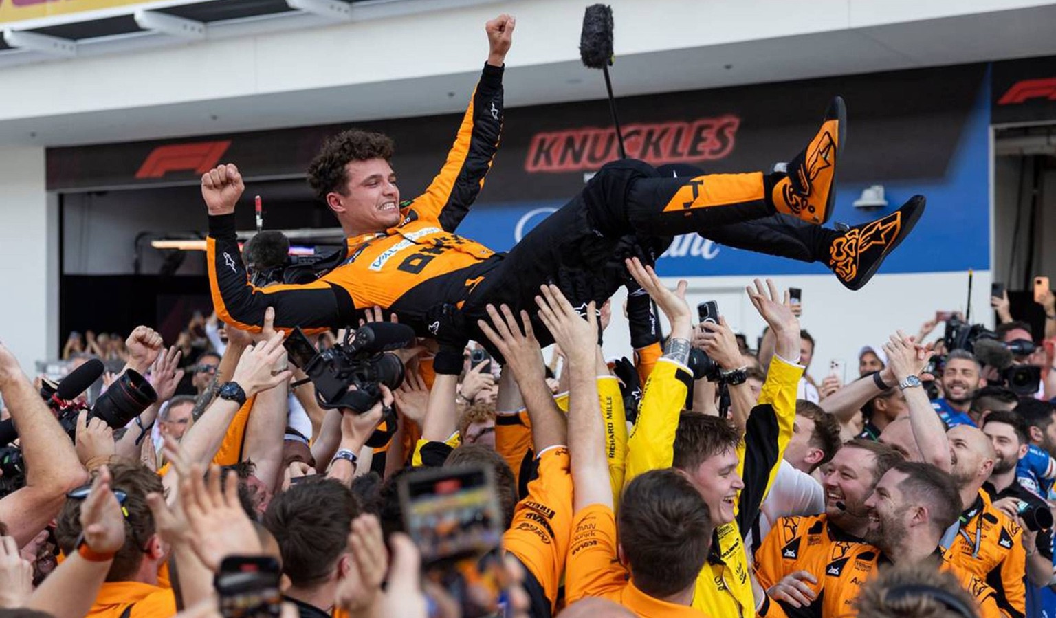 May 5, 2024: McLaren driver Lando Norris of Britain celebrates with crew members after winning the Formula One Miami Grand Prix at the Miami International Autodrome on Sunday, May 5, 2024, in Miami Ga ...