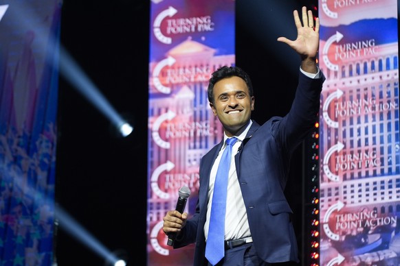 Vivek Ramaswamy waves to the crowd as he arrives to speak before Republican presidential nominee former President Donald Trump during a campaign rally at Thomas &amp; Mack Center, Thursday, Oct. 24, 2 ...