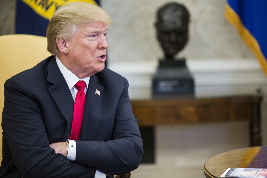 epa06492507 US President Donald J. Trump speaks while meeting with North Korean defectors in the Oval Office of the White House in Washington, DC, USA, 02 February 2018. Trump met with several North K ...