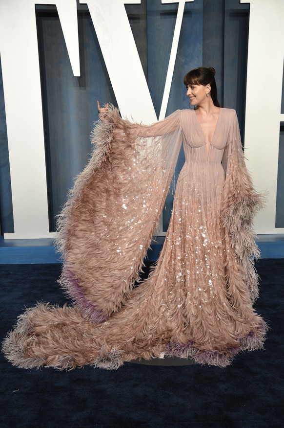 Dakota Johnson arrives at the Vanity Fair Oscar Party on Sunday, March 27, 2022, at the Wallis Annenberg Center for the Performing Arts in Beverly Hills, Calif. (Photo by Evan Agostini/Invision/AP)
Da ...