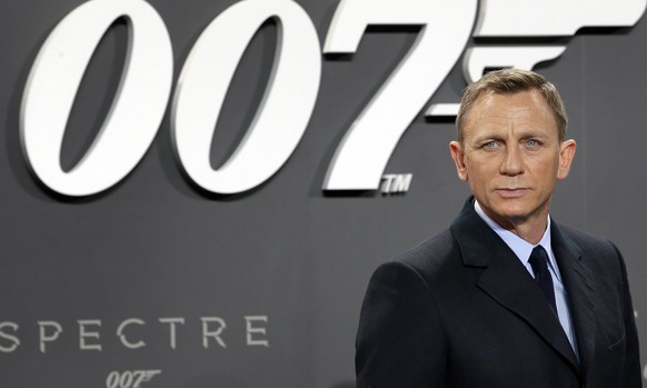 FILE - This is a Wednesday, Oct. 28, 2015 file photo of actor Daniel Craig poses for the media as he arrives for the German premiere of the James Bond movie &quot;Spectre&quot; in Berlin, Germany. The ...