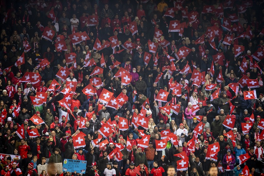 Swiss fans cheer during the 2022 FIFA World Cup European Qualifying Group C match between Switzerland and Bulgaria at the Swissporarena stadium in Lucerne, Switzerland, Monday, November 15, 2021. (KEY ...