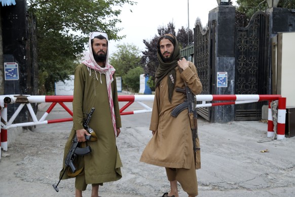 Taliban fighters pose for photograph in Kabul, Afghanistan, Tuesday, July 25, 2023. The Taliban announced Tuesday that all beauty salons in Afghanistan must now close as a one-month deadline ended, de ...