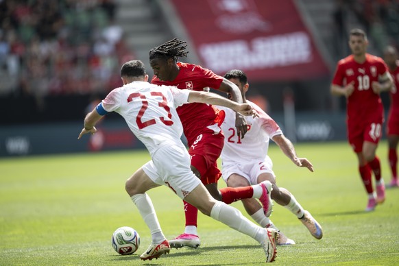 Jordan's Ehsan Haddad, left, and Switzerland's Johan Manzambi in action during the friendly soccer match between Switzerland and Jordan, at the kybunpark, in St. Gallen, Switzerland, Sunday, ...