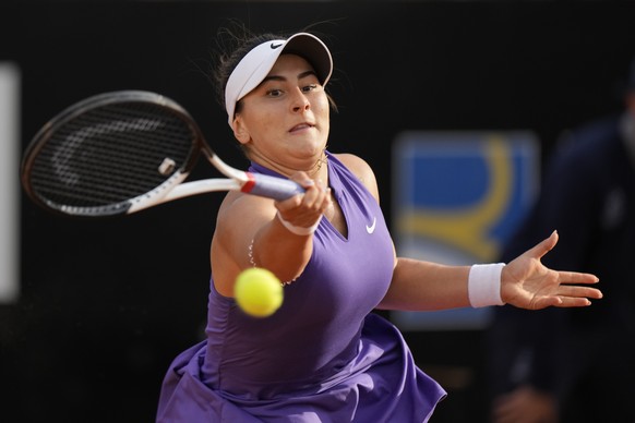 Bianca Andreescu returns the ball to Emma Raducanu during their match at the Italian Open tennis tournament, in Rome, Tuesday, May 10, 2022. (AP Photo/Andrew Medichini)