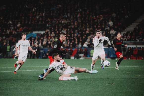 UEFA Champions League Group D: FC Salzburg - SL Benfica Lisbon SALZBURG, AUSTRIA - DECEMBER 12: Petar Ratkov of FC Salzburg in action against Nicolas Otamendi of SL Benfica Lisbon during the UEFA Cham ...