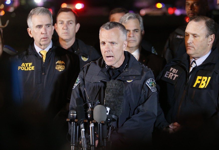 epa06617210 (L-R) ATF Agent in Charge Fred Milanowski, Interim Austin Police Chief Brian Manley and FBI Special Agent in Charge Christopher Combs speak to the media as law enforcement investigatea the ...