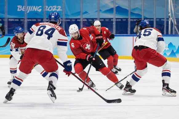 epa09758760 Yannick Weber of Switzerland (C) in action during the Men&#039;s Ice Hockey Qualification Play-off match between Switzerland and Czech Republic at the Beijing 2022 Olympic Games, Beijing,  ...