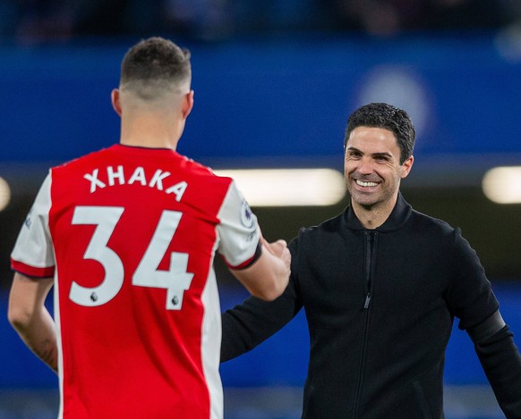 Chelsea v Arsenal Premier League Mikel Arteta manager of Arsenal and Granit Xhaka of Arsenal during the Premier League match between Chelsea and Arsenal at Stamford Bridge, London PUBLICATIONxNOTxINxU ...