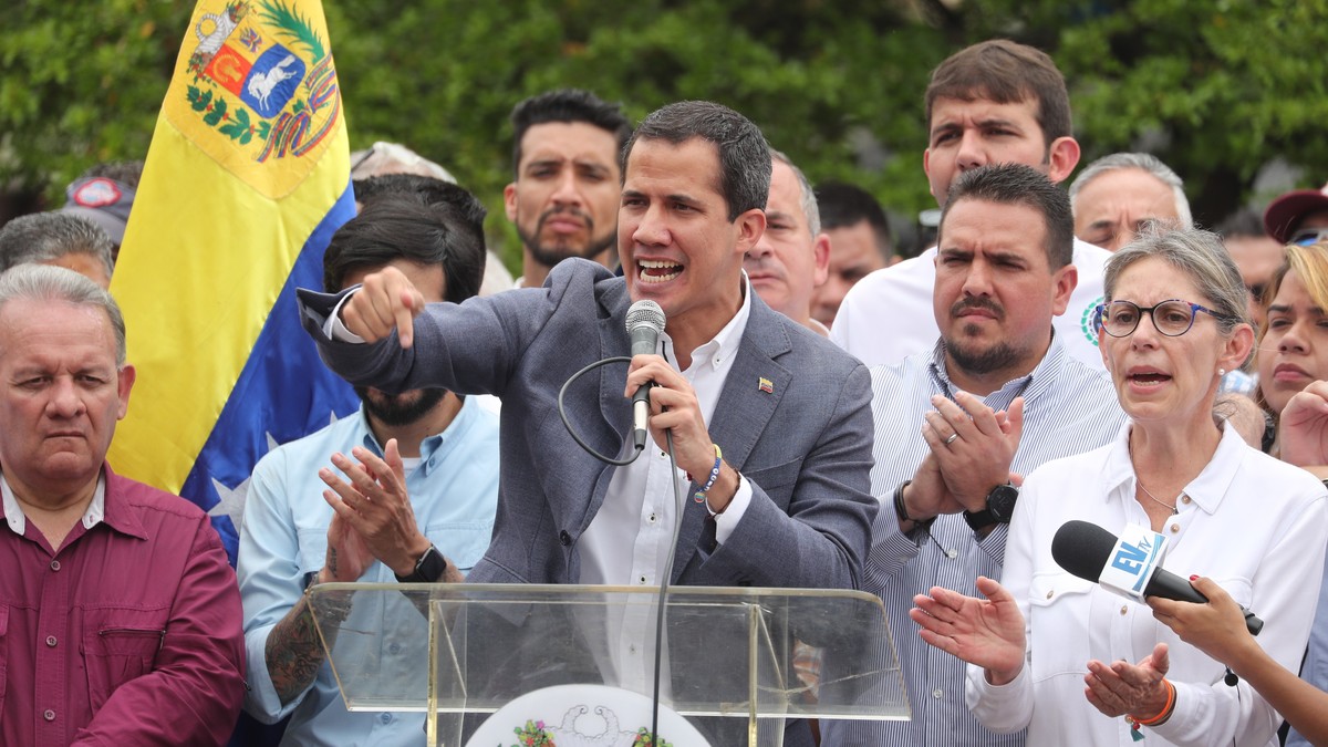 epa07563130 Venezuela's National Assembly President Juan Guaido delivers a speech during a demonstration against the government of Nicolas Maduro at Alfredo Sadel Square in Caracas, Venezuela, 11 ...