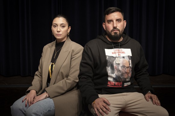 Shmuel Moha, right, a survivor from Kibbutz Nirim and Yuval Raphael, left, a survivor of the attack on the Nova music festival pose for photograph after a news conference of the movement &quot;Never a ...