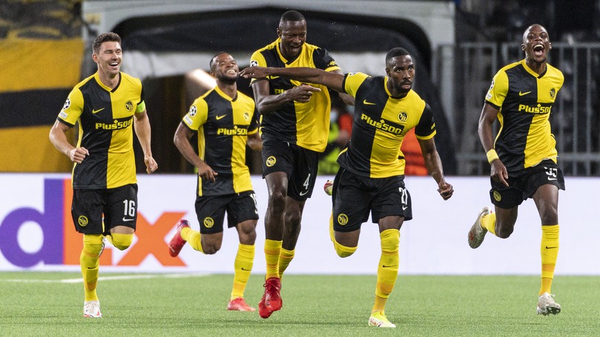 Young Boys&#039; Ulisses Garcia, 2nd right, celebrates with teanmates after scoring to 3:1 during the UEFA Champions League Play-off first leg soccer match between BSC Young Boys and Ferencvaros TC, o ...