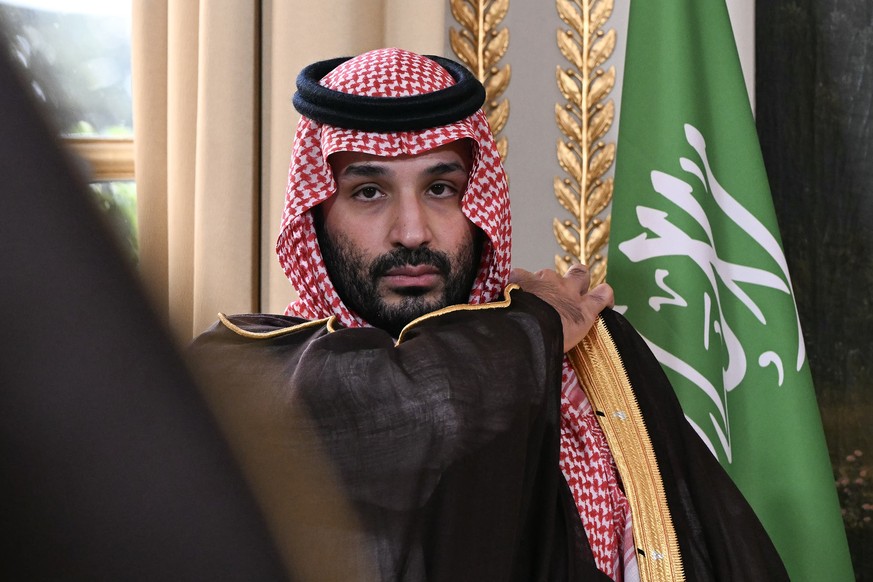 epa13189037 Saudi Arabia's Crown Prince Mohammed bin Salman looks on as he attends a trade agreement signature ceremony at the Elysee Palace in Paris, France, 24 August 2026. EPA/LOU BENOIST / PO ...
