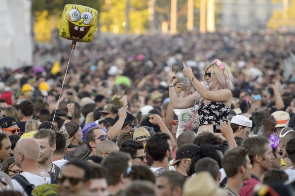 Participants make their way through the streets during the 24nd Street Parade, an annual dance music parade, in the city center of Zurich, Switzerland, Saturday, August 29, 2015. Hundreds of thousands ...