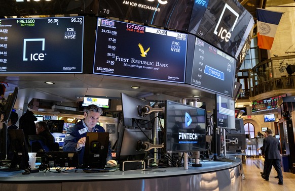 Traders work on the floor at the New York Stock Exchange in New York, Monday, March 13, 2023. (AP Photo/Craig Ruttle)