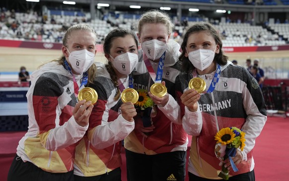 epa09390439 Golden medalists Charlotte Becker, Franziska Brausse, Lisa Brennauer and Lisa Klein Germany celebrate during award ceremony of the Women&#039;s Team Pursuit competition during the Track Cy ...