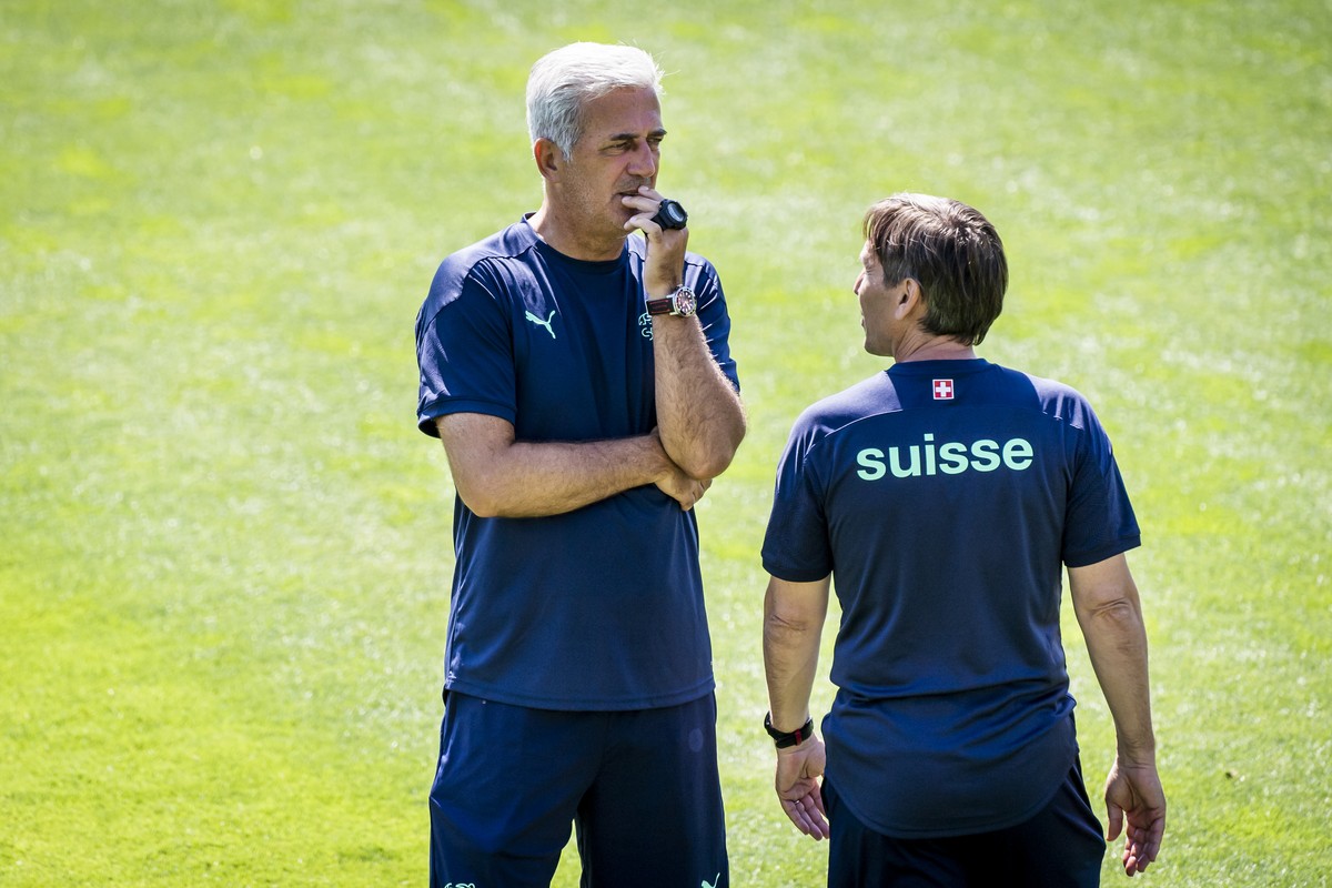 Switzerland's head coach Vladimir Petkovic, left, and Swiss assistant coach Antonio Manicone, right, react during a training session for the Euro 2020 soccer tournament at the Tre Fontane sports  ...