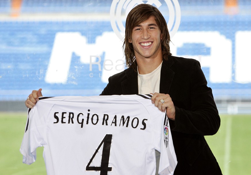 Real Madrid's new defender Sergio Ramos shows his shirt during the official presentation for the Spanish soccer club, Madrid, Thursday Sept. 8, 2005. Ramos, who has signed an eight-year contract, is E ...