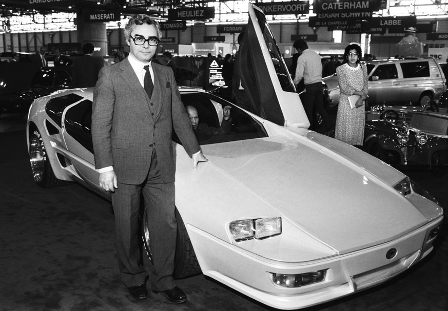 Car designer Franco Sbarro poses next to his at the 57th Geneva International Motor Show "Challenge" with side-hinged doors, made on March 4, 1987. (KEYSTONE/Str)=== ...