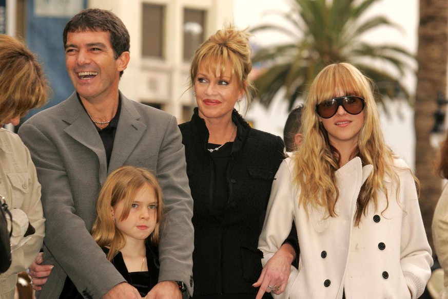 Antonio Banderas and Melanie Griffith with Stella Banderas and Dakota Johnson at a ceremony honoring Antonio Banderas with a star Hollywood Walk of Fame. Hollywood Boulevard, Hollywood, CA. 10-18-05 ,