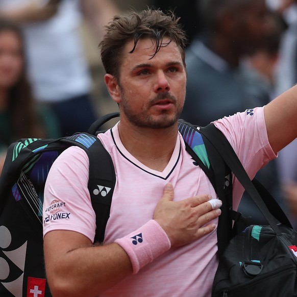 epa09969756 Stan Wawrinka of Switzerland reacts after losing against Corentin Moutet of France in their men?s first round match during the French Open tennis tournament at Roland ?Garros in Paris, Fra ...