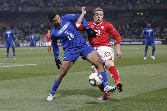 Switzerland's Xherdan Shaqiri, right, fights for the ball with Honduras' Mauricio Sabillon, left, during Group H's 2010 FIFA soccer World Cup preliminary round match between Switzerland and Honduras i ...