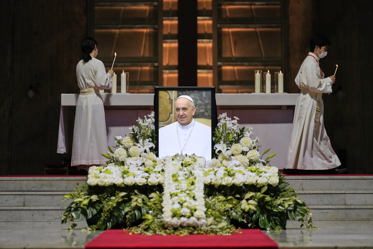 Priests prepare for a memorial Mass for the late Pope Francis near his portrait at St. Mary's Cathedral in Tokyo, Sunday, April 27, 2025. (AP Photo/Hiro Komae, Pool)
Japan Pope Francis Global Rea ...