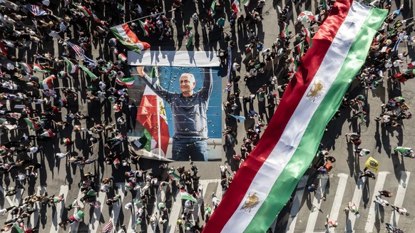 epaselect epa12788565 An aerial view taken with a drone shows a crowd surrounding an image of Reza Pahlavi, the oldest son of Mohammad Reza Pahlavi, the late last Shah of Iran, during a march and rall ...