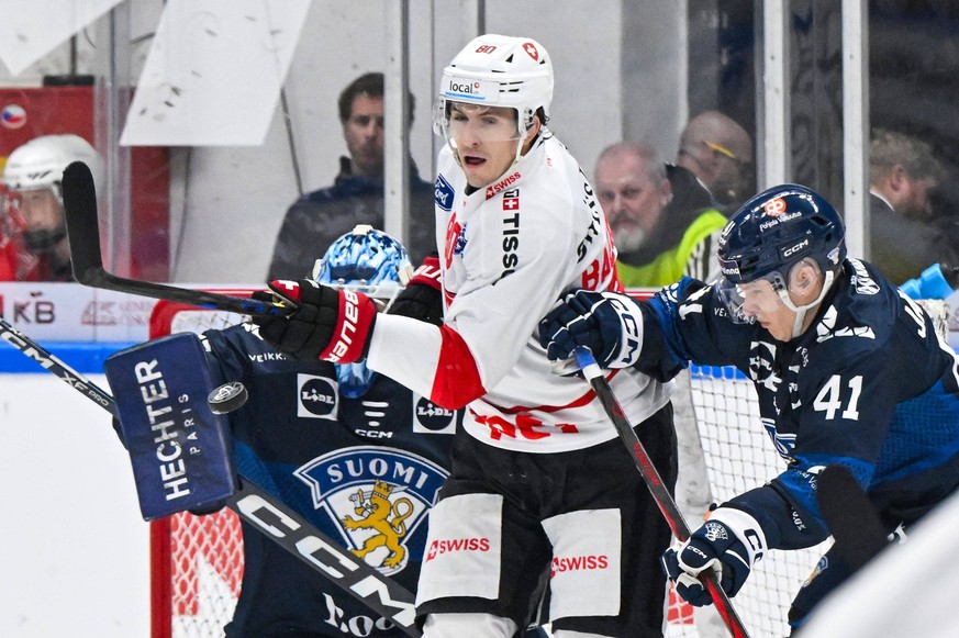L-R goalkeeper Emil Larmi FIN, Nicolas Baechler SUI and Jan-Mikael Jarvinen FIN in action during the Czech Hockey Games, part of the Euro Hockey Tour EHT, match Switzerland vs Finland, in Brno, Czech  ...