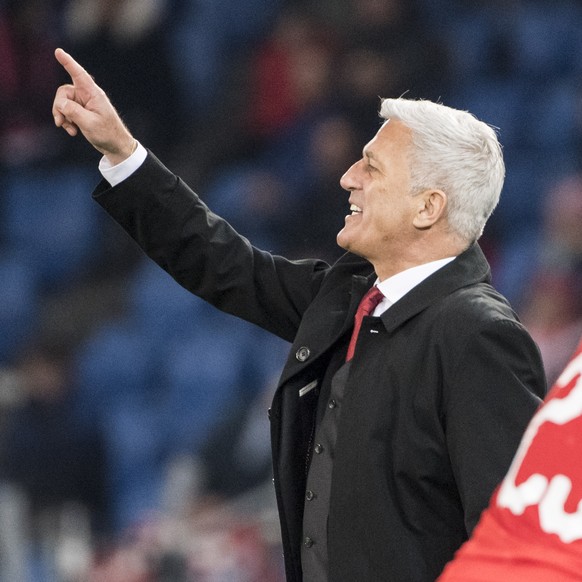 Swiss head coach Vladimir Petkovic, left, gestures next to Kevin Mbabu during the UEFA Euro 2020 qualifying Group D soccer match between Switzerland and Denmark, at the St. Jakob-Park stadium in Basel ...