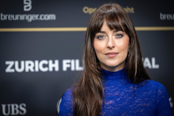 American actress and film producer Dakota Johnson, arrive on the Green Carpet at the Opening Night of the 21th Zurich Film Festival (ZFF) in Zurich, Switzerland, Thursday, Sept. 25, 2025. (Andreas Bec ...