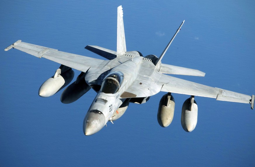 FILE - This US Air Force photo shows a Navy F/A-18 Super Hornet in flight, July 17, 2019, after refueling over the Pacific Ocean near the coast of Brisbane, Australia.  Boeing announces...