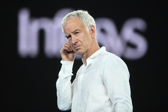 epa07289515 US tennis legend John McEnroe stands on the court after the men&#039;s second round match between Matthew Ebden of Australia and Rafael Nadal of Spain at the Australian Open tennis tournam ...