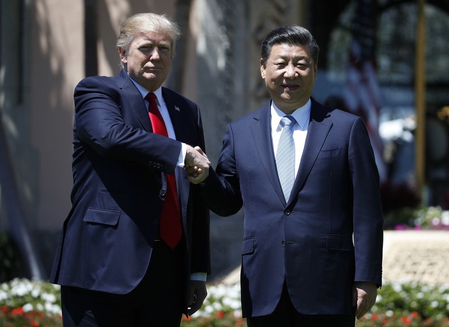 President Donald Trump and Chinese President Xi Jinping shake hands after a bilateral meeting at Mar-a-Lago, Friday, April 7, 2017, in Palm Beach, Fla. Trump was meeting again with his Chinese counter ...