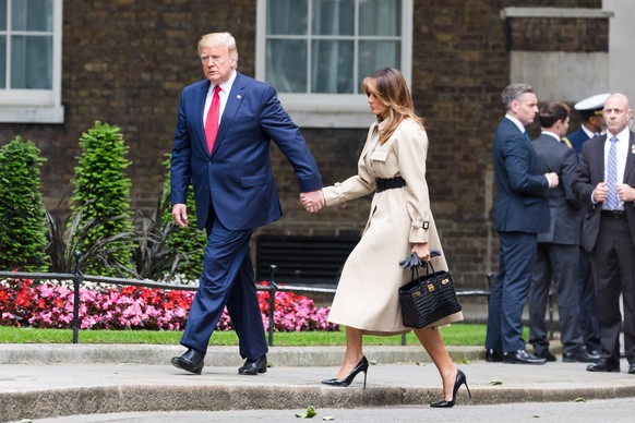 epa07624169 US President Donald J. Trump (L) and his wife Melania Trump (R) attend a meeting with Britain&#039;s Prime Minister Theresa May and her husband Philip May at 10 Downing Street in London, B ...