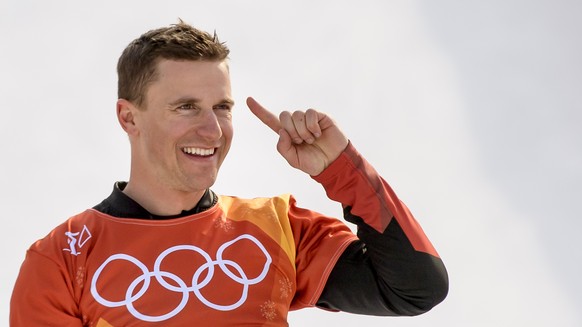 Gold medal winner Nevin Galmarini of Switzerland celebrates during the victory podium of the Men Snowboard Parallel Giant Slalom Finals in the Phoenix Snow Park during the XXIII Winter Olympics 2018 i ...