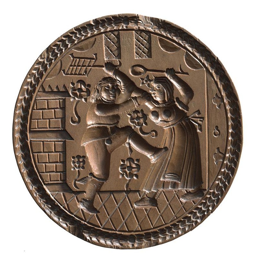 Gebäckmodel. Mit Darstellung eines streitendes Ehepaares. Herstellung: Ostschweiz (Region); Ernst Weber (Sammlung). 1690 - 1700. Ø 13,3 cm. Holz.