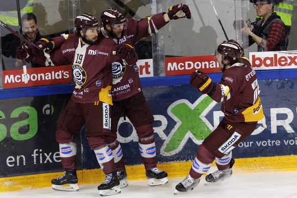 Geneve-Servette&#039;s forward Josh Jooris, left, celebrates his goal with his teammates Geneve-Servette&#039;s forward Teemu Hartikainen, centre, and Geneve-Servette&#039;s defender Sami Vatanen, lef ...