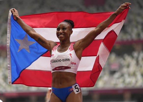 Jasmine Camacho-Quinn, of Puerto Rico celebrates after winning the gold in the women&#039;s 100-meters hurdles final at the 2020 Summer Olympics, Monday, Aug. 2, 2021, in Tokyo, Japan. (AP Photo/Marti ...