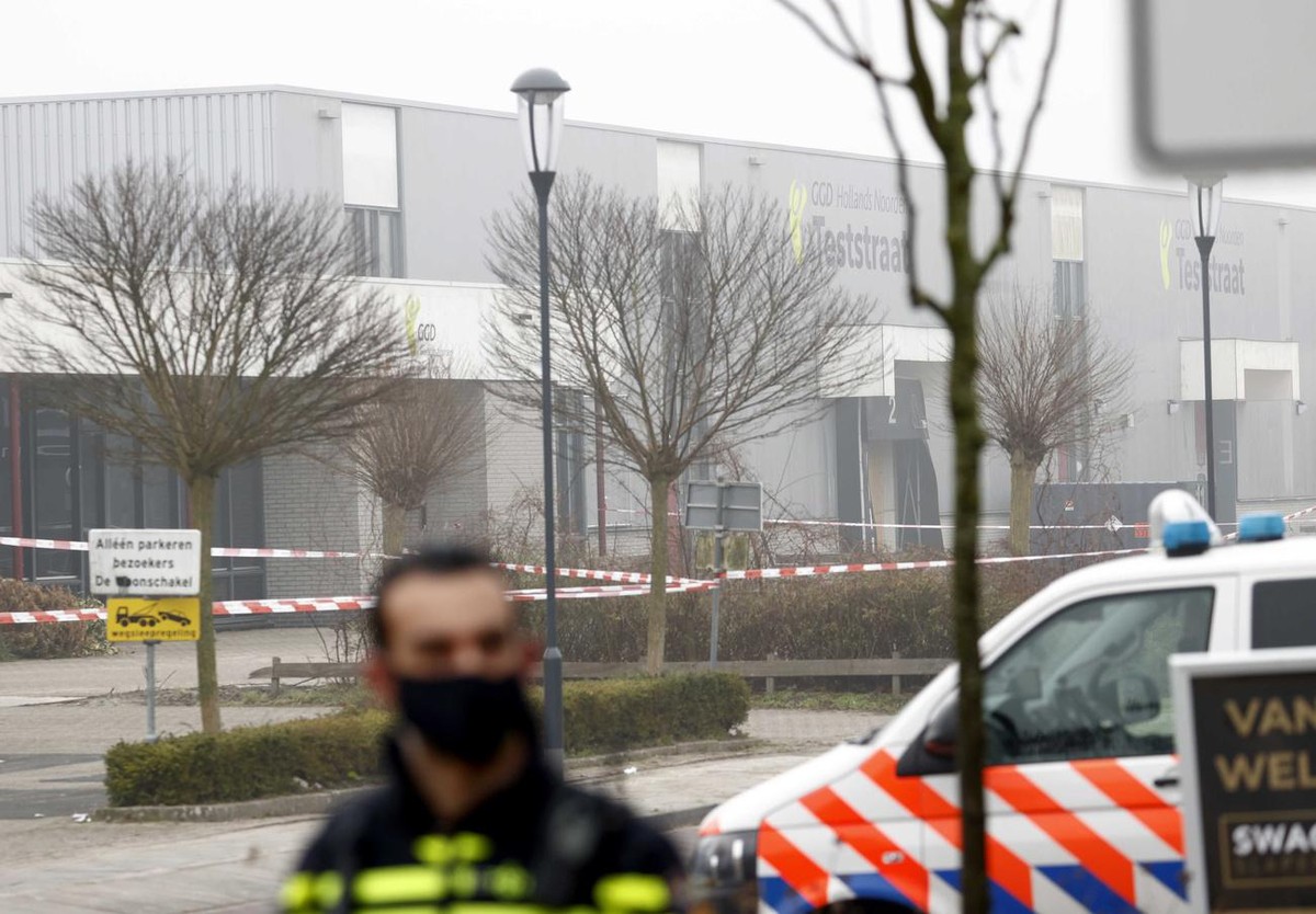 epa09048091 Barrier ribbons are fixed by police at the scene at the coronavirus testing location in Bovenkarspel, North Holland, The Netherlands, where an explosion happened 03 March 2021. According t ...