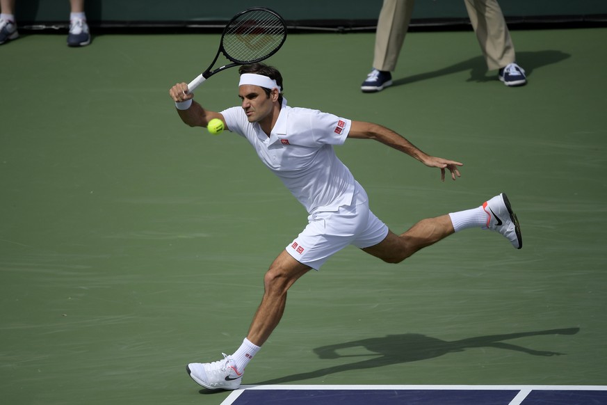 Roger Federer, of Switzerland, returns a shot to Peter Gojowczyk, of Germany, at the BNP Paribas Open tennis tournament Sunday, March 10, 2019, in Indian Wells, Calif. (AP Photo/Mark J. Terrill)